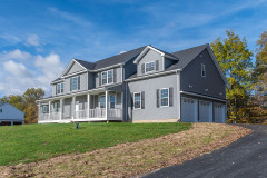 Front view with three car garage