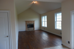 Family room with cathedral ceiling and wood burning fireplace