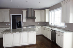 Kitchen featuring granite countertops and upgraded cabinets