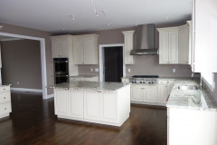 Kitchen with large island and hardwood floors