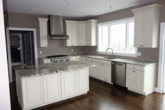 Kitchen with large window looking onto back yard