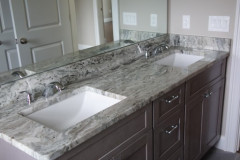 Double vanity with granite countertops in main bathroom