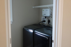 Full-sized laundry room on first floor