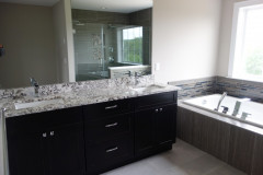 Master bathroom with double vanity and granite countertop