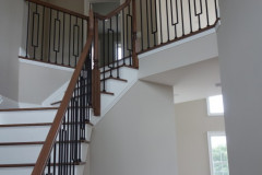 Stairway to second floor with iron spindles