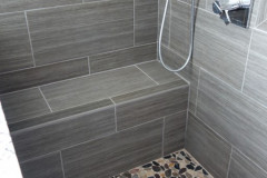 Tile floor and bench in master shower