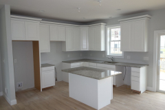 Designer kitchen with island and granite countertops