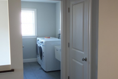 Convenient second floor laundry room with utility sink