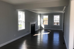 The Hamilton - view from family room into living room with fireplace