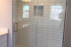 Large tiled walk-in shower in master bathroom