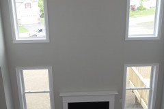 Gas fireplace and two story windowed wall in family room