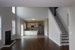 View from two story family room into kitchen