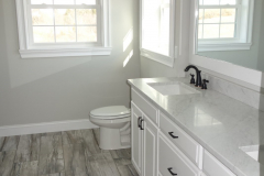 Ceramic tile flooring standard in all bathrooms
