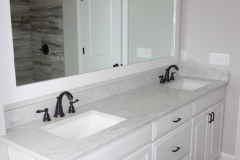 Double vanity with standard custom-made granite countertop, available in many colors