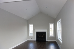 Family room featuring premier oak hardwood floors (available in multiple stain colors), and standard gas fireplace