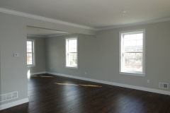 Natural hardwood floors and crown molding are standard in all public rooms